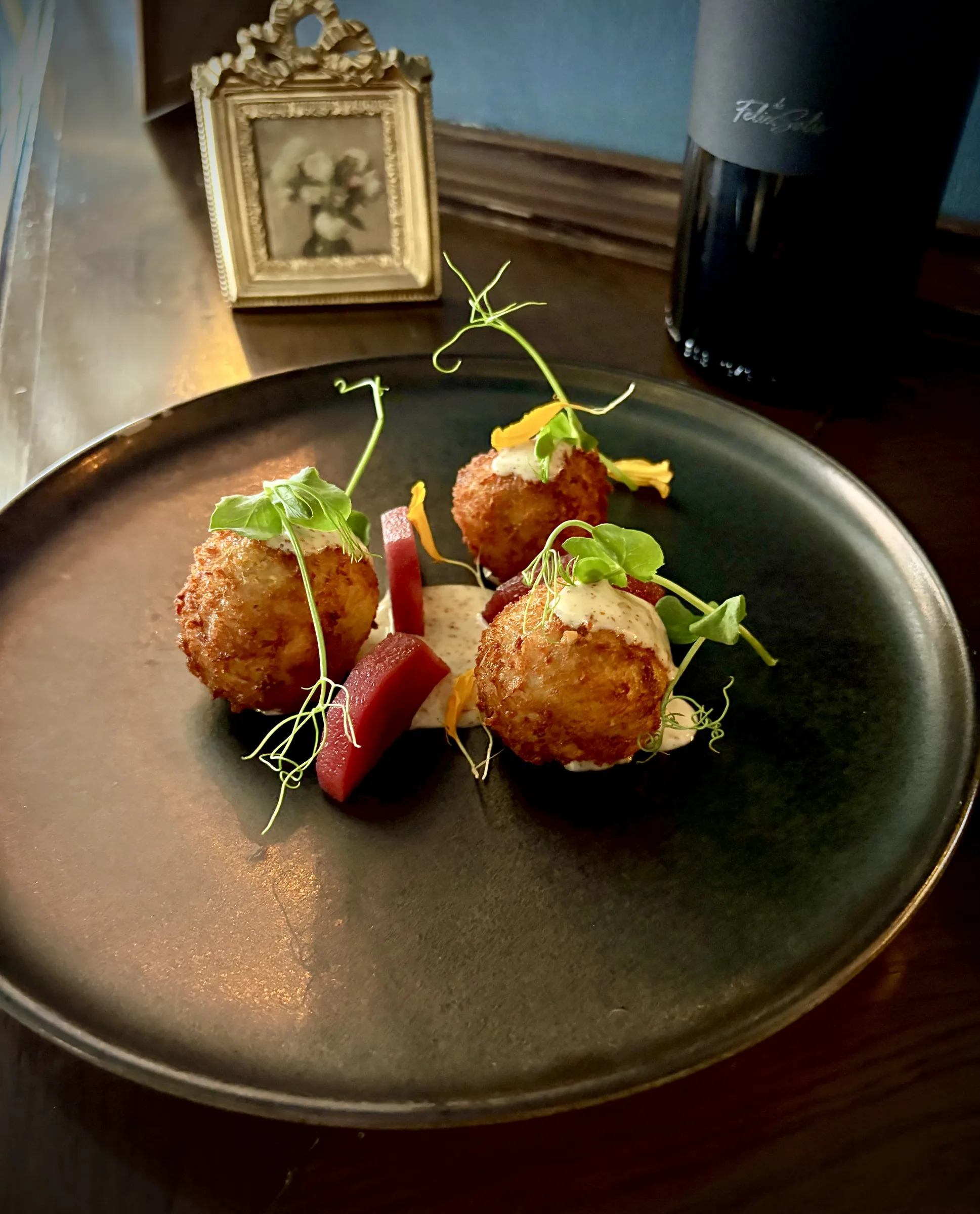 Golden croquettes served with garnishes